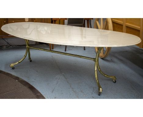 DINING TABLE, 75cm H x 220cm W x 115cm D, oval faux marble top on brass bamboo legs and castors. 