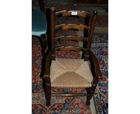 An appealing seagrass seated child's ladder back Elbow Chair