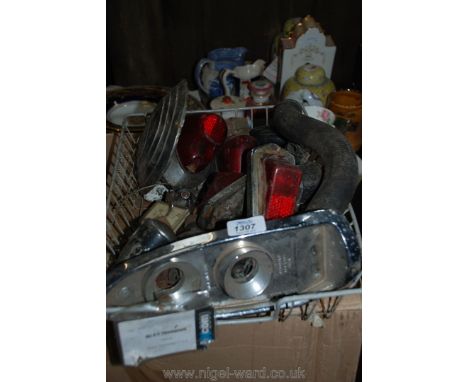A box of Motor spares including two pairs of rear lights, square clock, fuel, oil and ammeter gauges, two bicycle dynamos, st