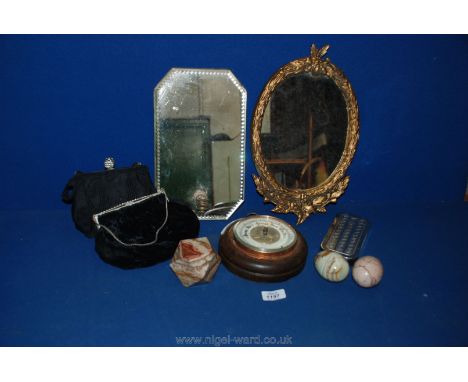Two mirrors, circular weather vane, two black bags, etc.