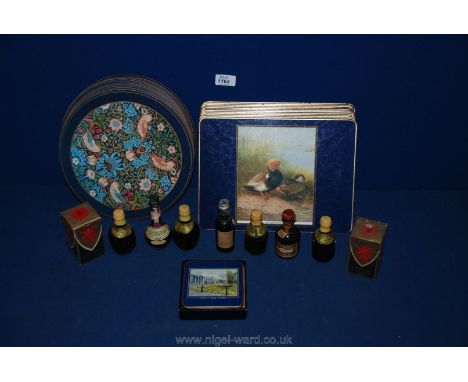 A quantity of table mats, together with two boxed miniature Dimple Scotch Whiskey, Drambuie, Cornish mead 'Can Can', etc.