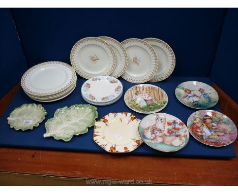 A quantity of plates including Royal Worcester dinner plates, Wedgwood display plates, Royal Doulton plates, Fitz and Floyd l