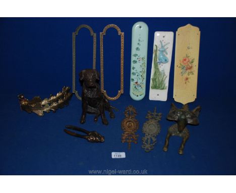 A box of miscellaneous including brass fox door knocker, pair of lion nutcrackers, figure of dog sitting, brass door plates, 