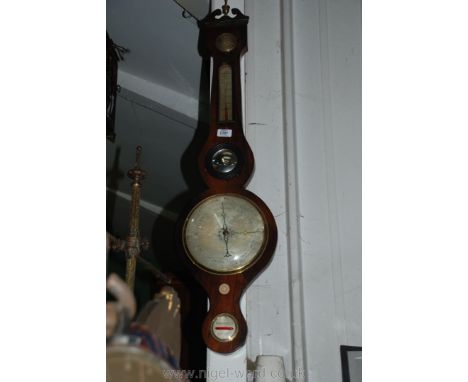 A Walnut cased five point Banjo Barometer featuring a hygrometer, thermometer, mirror, barometer and level, 39'' overall