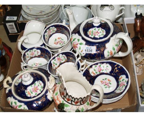 A part Gaudy Welsh Imari pattern tea set including a teapot (spout chipped and a crack on the side), 4 saucers, 6 cups, two h