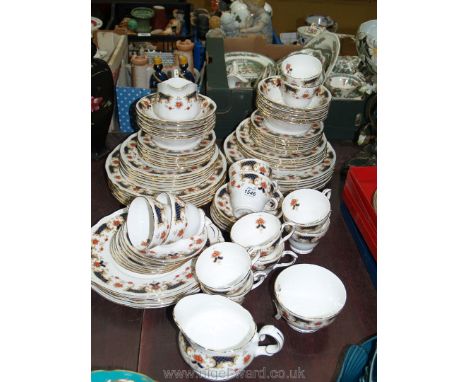 A quantity of Duchess Westminster pattern dinner and tea services; dinner plates, sweet plates, cups, pudding bowls, etc.
