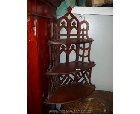 A Mahogany wall hanging three stage corner Shelf unit having fretworked detail/frame, 22'' wide x 37 1/4'' high approx.