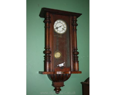A Mahogany cased Vienna type Wall Clock having two train spring action movement, the white dial with Roman numerals, labelled