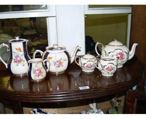 A Sadler teapot, milk jug (chipped) and lidded sucrier together with a Sadler teapot, hot water jug, sugar bowl, etc a/f.