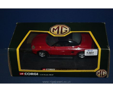 A Corgi MGF model car, in original box, 1:18 scale mode in red with black interior and black hood, live steering wheel, lifti