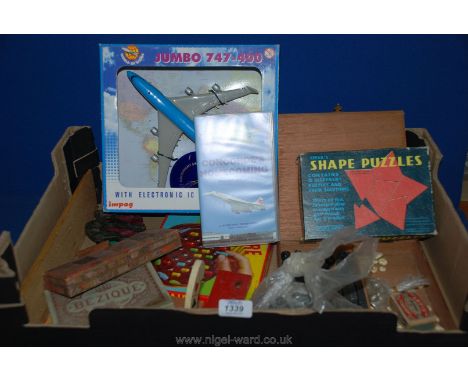 A quantity of old games including solitaire, cribbage board, packs of playing cards (some unopened), Jumbo 747 model, etc.