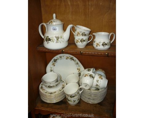 A Royal Worcester 'Larchmont' Teaset comprising eleven cups, twelve saucers, teapot, milk jug, sugar bowl and bread &amp; but