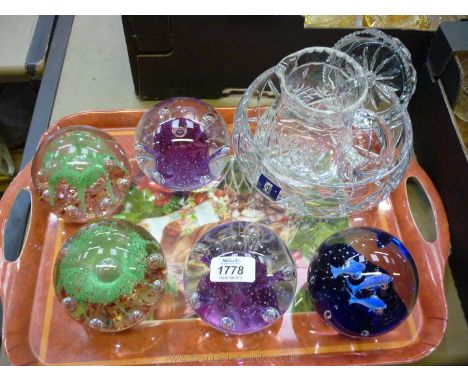 A cut glass bowl, jug and fruit squeezer and five large Paperweights