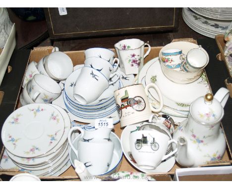A white ground part Teaset decorated with swallows comprising bread &amp; butter plate, three cups and saucers, tea plates, m