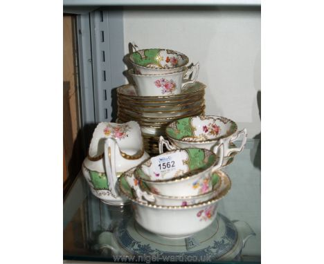 A part Coalport tea set, floral with green and gold decoration to include; cups, saucers, plates, milk jug and sugar bowl.