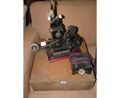 A Pathescope 95mm vintage 'Baby' Cine Projector and accessiories and manual, etc.