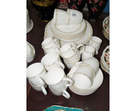 A quantity of dinner/tea ware in white with gold trim, dinner plates, side plates, saucers, cups, etc Elegance Gold by Maxwel