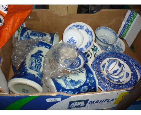 A quantity of blue and white china including cups, saucers, jugs, plates, etc.