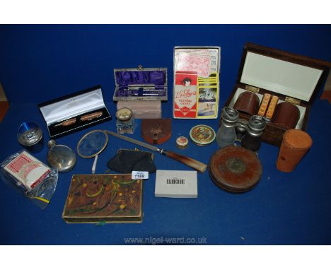 A quantity of miscellanea including a pair of opera glasses, leather tape measure, inkwell, cased stirrup cups, playing cards