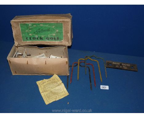 An antique clock Golf set by Northwood with hoop gauge (4 x 1/2)