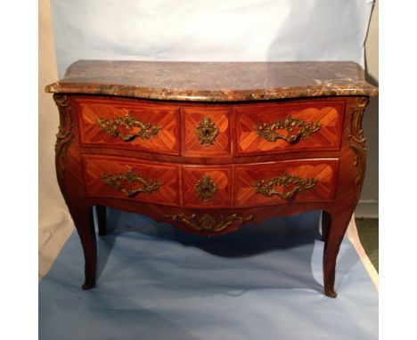 A commode with marble top and oak linings