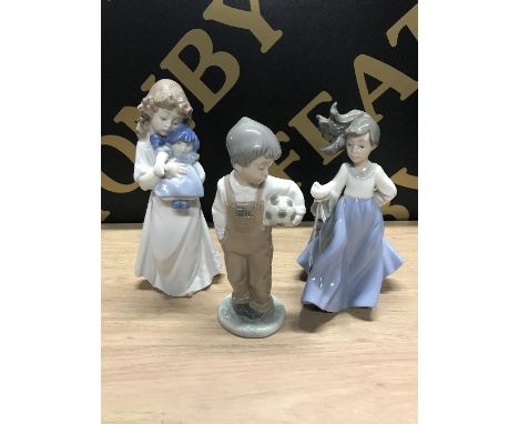 3 PIECES OF NAO BY LLADRO , BOY WITH BALL , GIRL WITH DOVE , GIRL WITH A DOLL