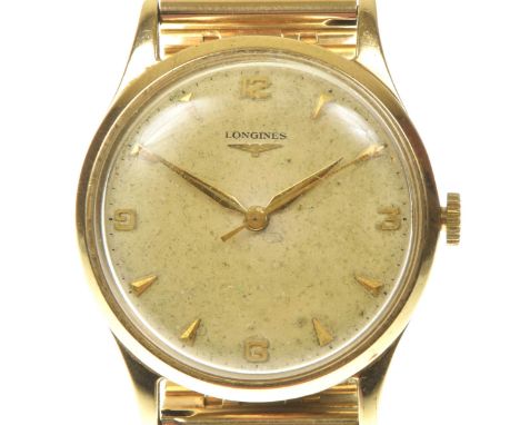 Longines: A 9k gold manual wind bracelet watchThe cream tone signed dial, with applied baton hour markers with Arabic numeral