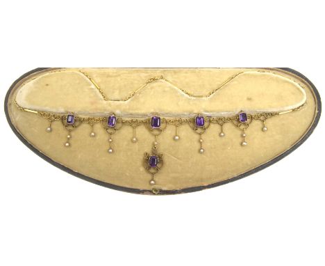 A Victorian amethyst and seed pearl fringe necklaceThe step-cut amethysts, each to a millegrain collet setting, suspending gr