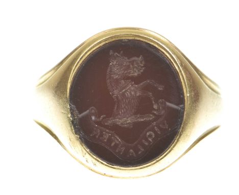 A late 19th century carved carnelian intaglio ringThe carnelian oval plaque carved to depict a collared prancing demi boar, w