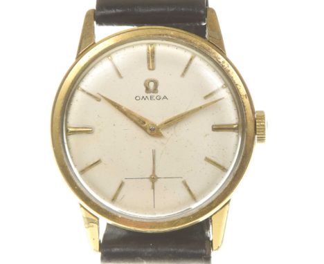 Omega: A gold plated manual wind wristwatchThe signed white dial, with gold tone baton hour markers, gold hands with luminous