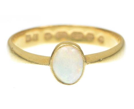 An opal single stone ringThe oval cabochon opal to a 22k gold band, ring size Q   CONDITION REPORT:  Under a 10x loupe, surfa