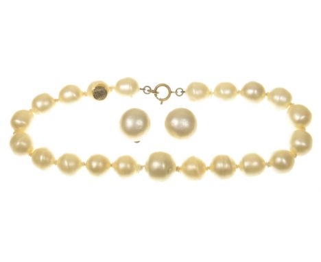 Chanel: A 1970's rare immitation pearl necklet and ear clipsThe large irregularly shaped immitation pearls, to a sping ring c