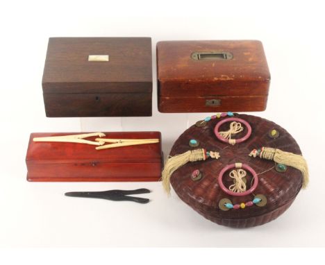 Three boxes and a sewing basket, comprising a Victorian rosewood rectangular sewing box with raised mother of pearl lid plaqu