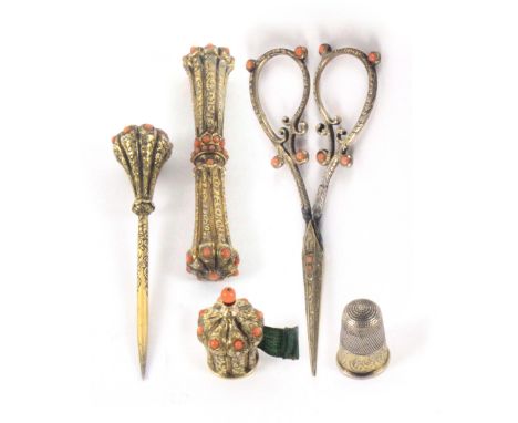 A fine set of five engraved silver gilt sewing tools, four coral mounted, comprising a waisted cylinder needle case with leaf