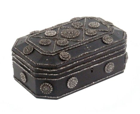 A French ebony and cut steel sewing box, of cut corner rectangular form, the whole decorated with cut steel and faceted raise