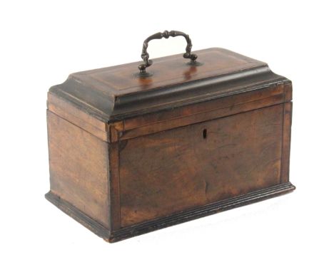 A Georgian mahogany tea caddy, of rectangular form, the ogee moulded lid with line inlay and brass carrying handle, the front
