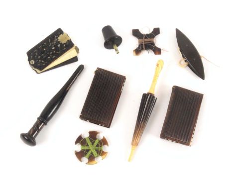A collection of nine 19th Century horn sewing tools, comprising a pair of needle books with ribbed covers, 6.3cms, an acorn t