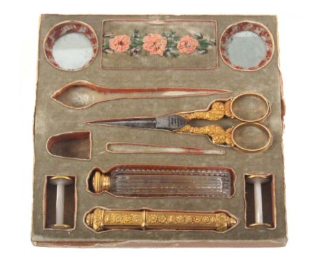 The tray from a Palais Royal work box with a selection of gold and other tools, comprising a pair of steel bladed scissors wi