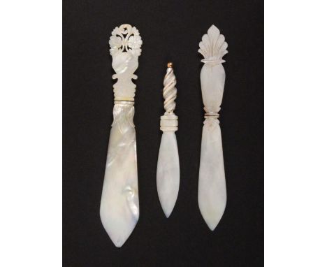 Three mother of pearl letter knives, probably Palais Royal, comprising an example with spiral carved handle bound in gilt wir