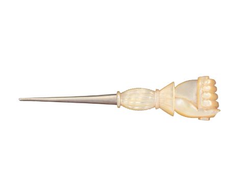 A large stiletto, probably Palais Royal, the tapering shaft to a mother of pearl handle carved as a cuff and clenched hand ho