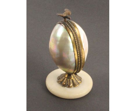 A French sewing companion in the style of Palais Royal, the circular alabaster base supporting a mother of pearl and gilt mou