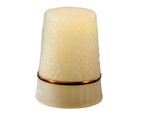 A 19th Century mother of pearl thimble, with a gilt rim over a plain frieze, in a modern leather case.                       