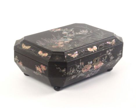 A Japanese black lacquer and pearl inlaid sewing box, of sarcophagal form, circa 1890, the whole decorated with birds, flower