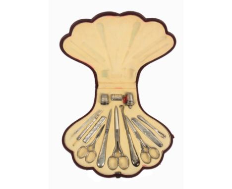 A silver and metal thirteen piece sewing set attributed to Sampson Mordan contained in a maroon leather case of scallop shell