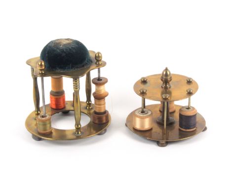 Two 19th Century brass reel stands, comprising a single tier example raised on four knurled feet with six reel rods below an 