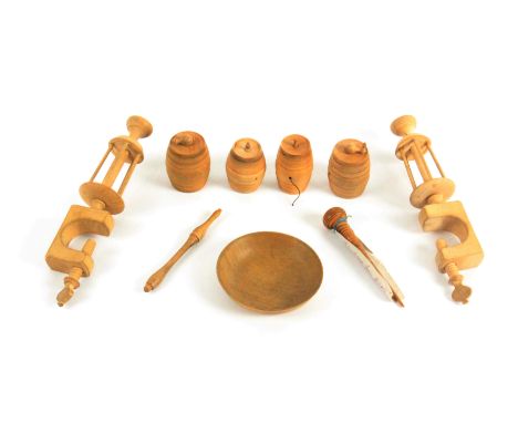 Nine white wood sewing accessories and tools, comprising a pair of winding clamps with bowl tops, 16cms, four various cotton 