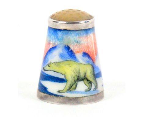 A Norwegian silver and enamel thimble by N.M. Erichsen, depicting a polar bear in mountainous snowy landscape, below a moonst