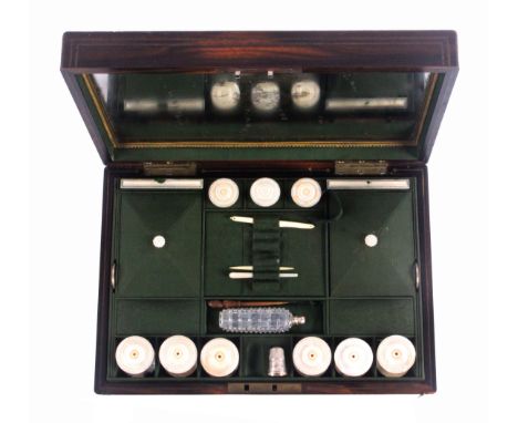 A well fitted coromandel wood sewing box attributed to Leuchars, circa 1840, of rectangular form, the front and lid with doub