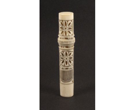 A mid 19th Century French ivory netting cylinder with tools, the body pierced with vertical lines and flower heads complete w