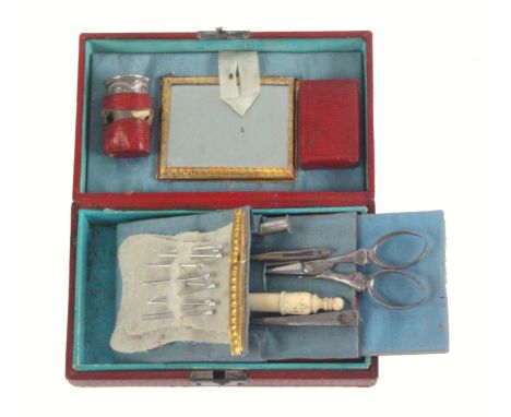 A small continental sewing box of rectangular form covered in patterned red leather, the lid inscribed in gilt 'Chriftianshav